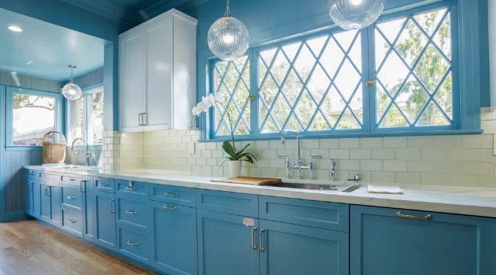 A kitchen with a sink and a window
