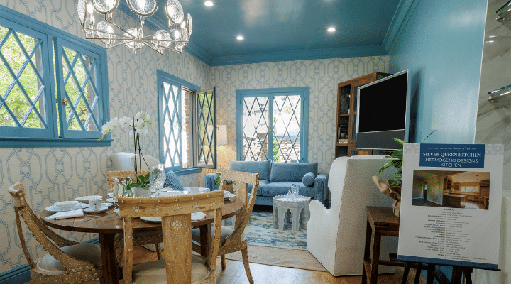 A living room filled with furniture and a fire place and a dining table